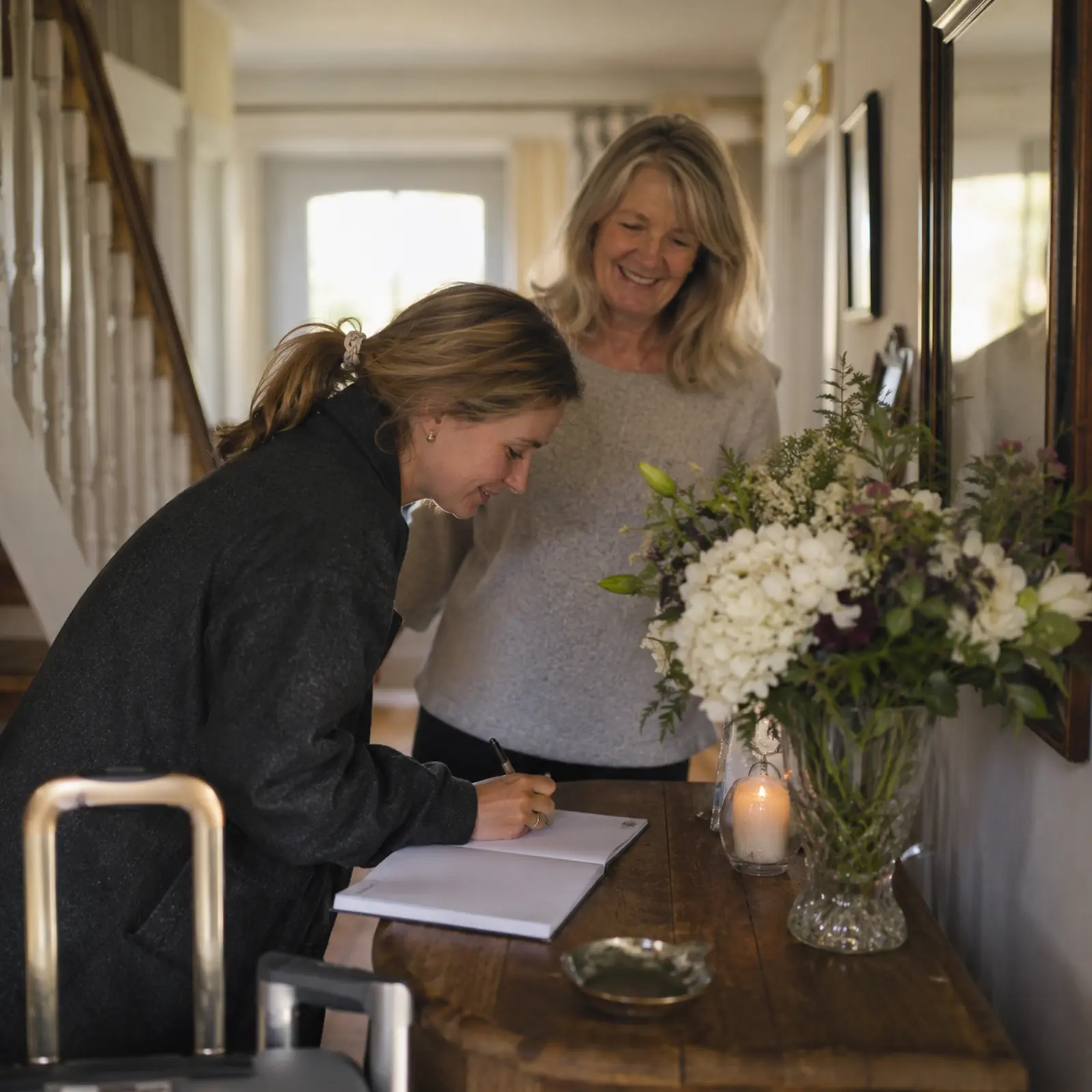 Guest signing the guest book at an Irish B&B