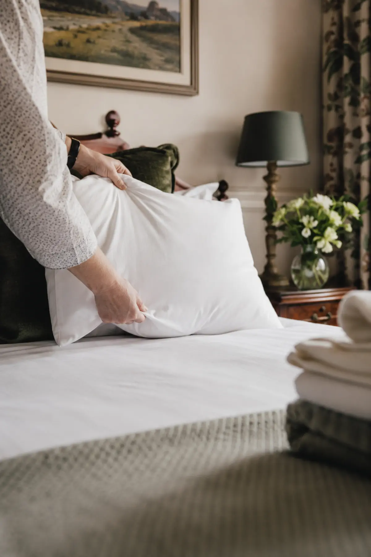Pillows plumped on a freshly made B&B bed